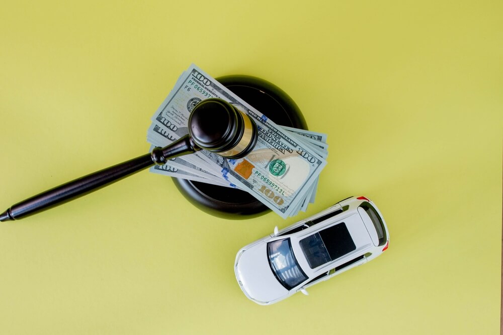 A photo of money on a judge's mallet